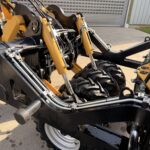 Koppeling, hydraulische leidingen en steunwielen van het Mylle maïsduwbord